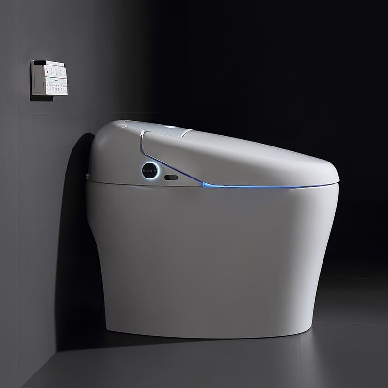 Floor-standing smart toilet with hidden water tank in modern bathroom